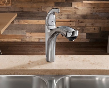 plumber tightening nut on water heater